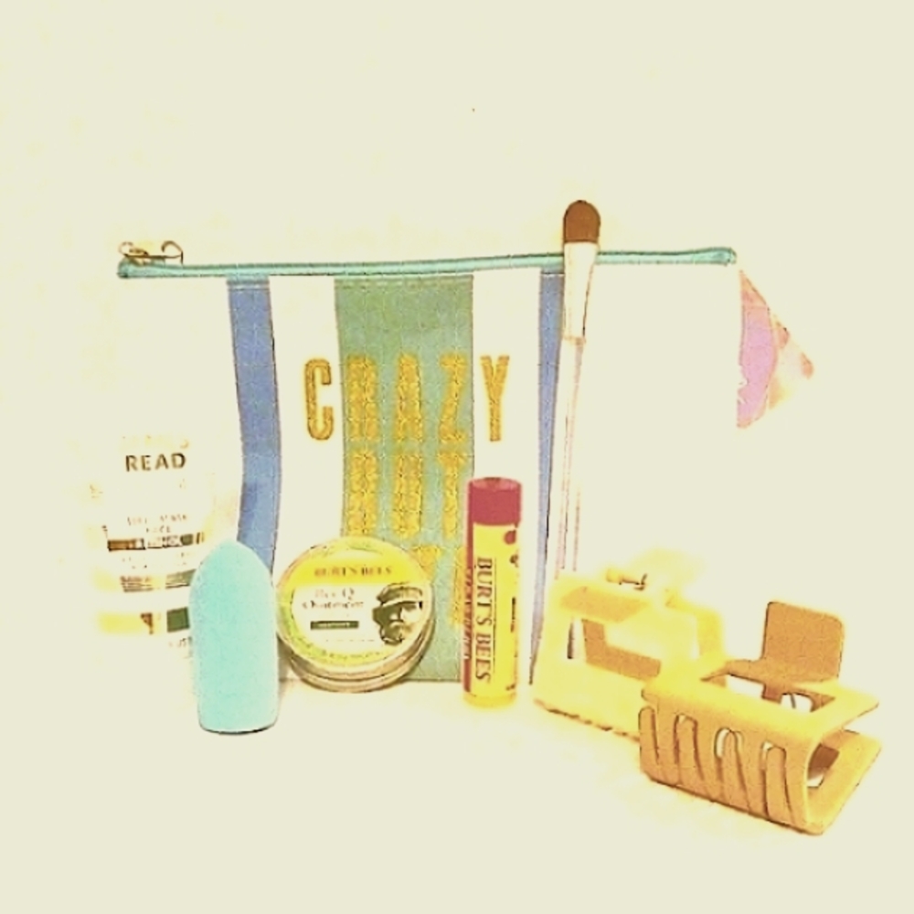 NWT COSMETIC WHITE AND BLUE STRIPE BAG WITH 7 SKIN & HAIR PRODUCTS